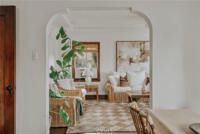 sitting room featuring arched walkways