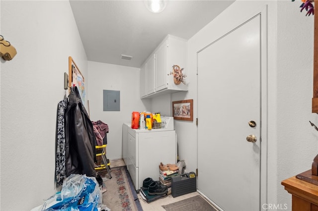 laundry area with visible vents, cabinet space, electric panel, and washer and dryer