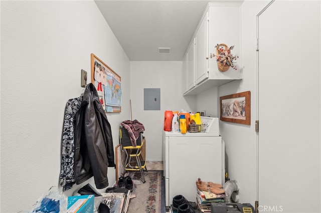 clothes washing area with cabinet space, visible vents, electric panel, and washer / clothes dryer