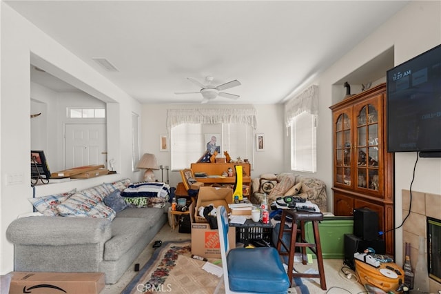 interior space featuring carpet floors, visible vents, and a ceiling fan