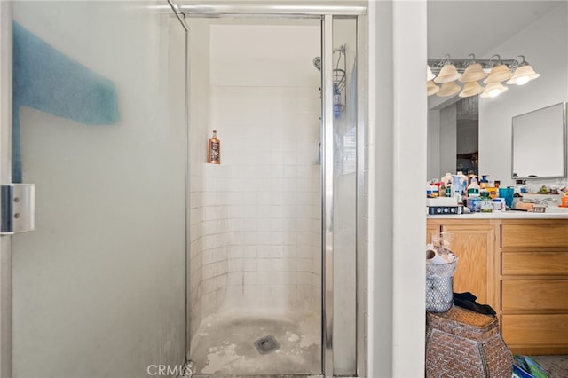 bathroom with a stall shower and vanity