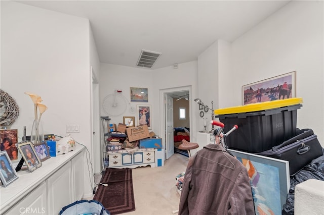 carpeted bedroom featuring visible vents