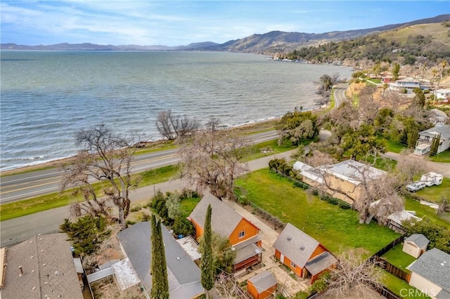 birds eye view of property featuring a water and mountain view