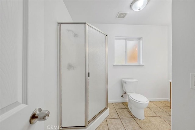 bathroom featuring a stall shower, baseboards, visible vents, toilet, and tile patterned floors