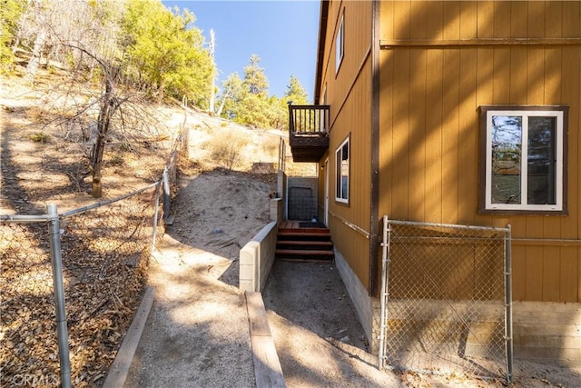 view of home's exterior with fence