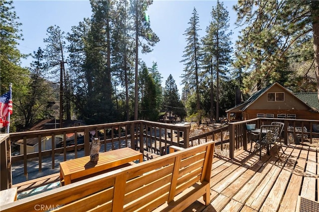 deck featuring outdoor dining space