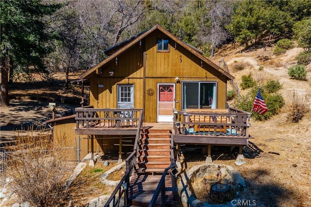 view of front of property featuring a deck and stairs