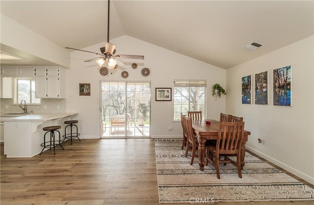 47384 Veater Ranch Rd, Coarsegold, CA 93614 - dining space featuring vaulted ceiling, light wood finished floors, a ceiling fan, and baseboards