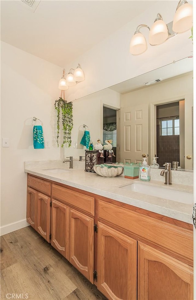 47384 Veater Ranch Rd, Coarsegold, CA 93614 - bathroom featuring double vanity and wood finished floors