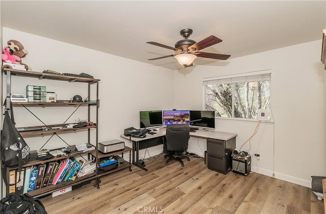 47384 Veater Ranch Rd, Coarsegold, CA 93614 - home office featuring light wood-style flooring, a ceiling fan, and baseboards