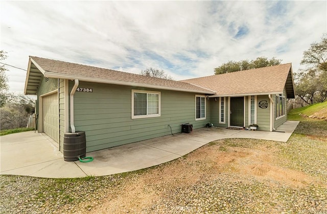 47384 Veater Ranch Rd, Coarsegold, CA 93614 - back of house with concrete driveway and an attached garage