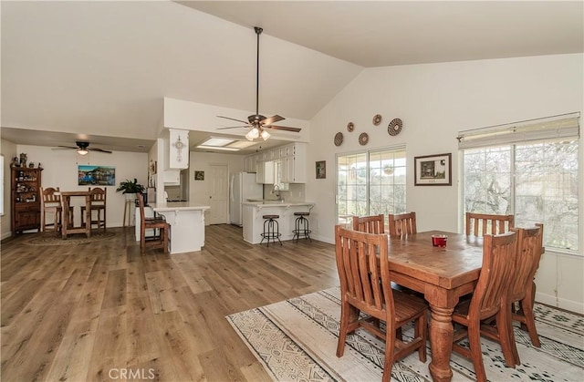 47384 Veater Ranch Rd, Coarsegold, CA 93614 - dining room featuring ceiling fan, high vaulted ceiling, plenty of natural light, and light wood finished floors