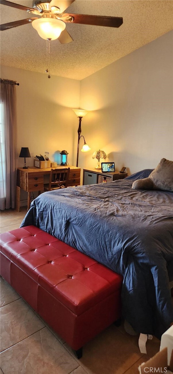27865 Quincy St, Castaic, CA 91384 - bedroom with ceiling fan and a textured ceiling