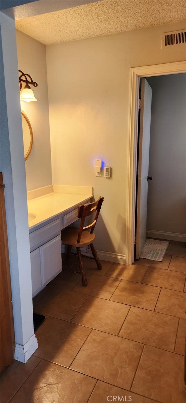27865 Quincy St, Castaic, CA 91384 - bathroom with vanity, a textured ceiling, and tile patterned flooring