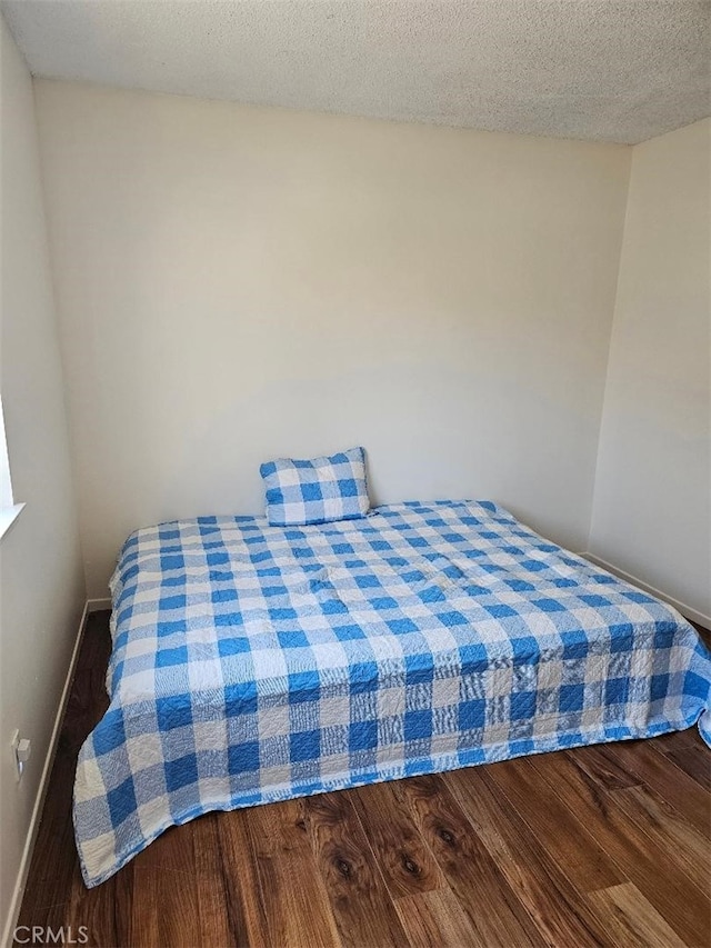 27865 Quincy St, Castaic, CA 91384 - bedroom featuring wood finished floors and a textured ceiling