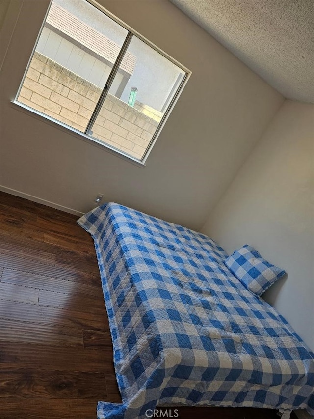 27865 Quincy St, Castaic, CA 91384 - bedroom with wood finished floors, lofted ceiling, and a textured ceiling