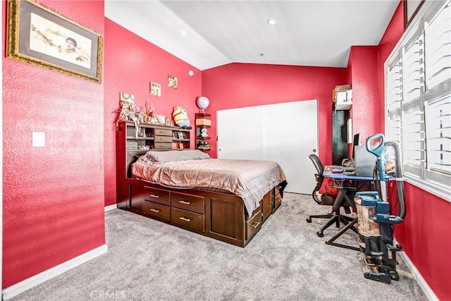 bedroom with carpet, vaulted ceiling, and baseboards