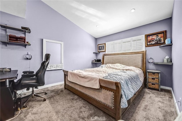 bedroom featuring lofted ceiling, carpet, and baseboards