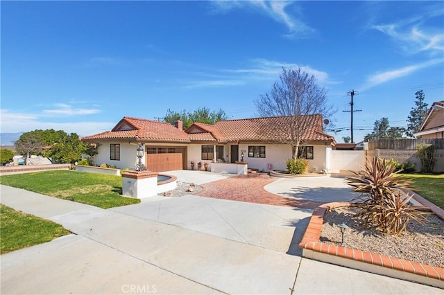 ranch-style house featuring concrete driveway, stucco siding, a tiled roof, fence, and a front yard