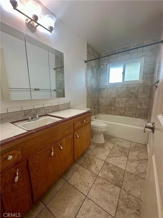 bathroom featuring bathtub / shower combination, toilet, tile patterned flooring, and vanity