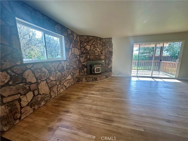 unfurnished living room featuring wood finished floors