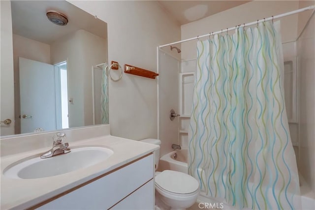 bathroom featuring shower / tub combo with curtain, vanity, and toilet