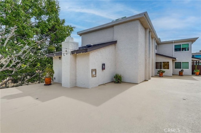 view of property exterior featuring a patio area and stucco siding