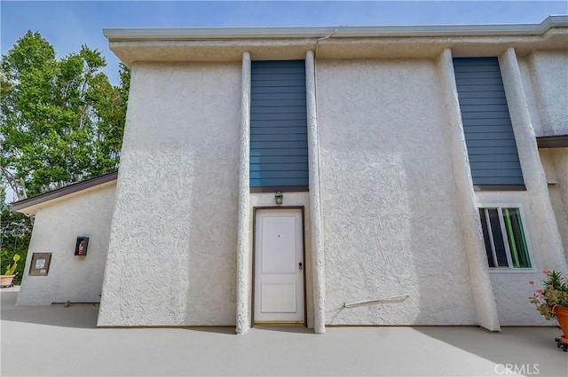 exterior space featuring stucco siding