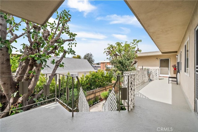 view of patio featuring a balcony