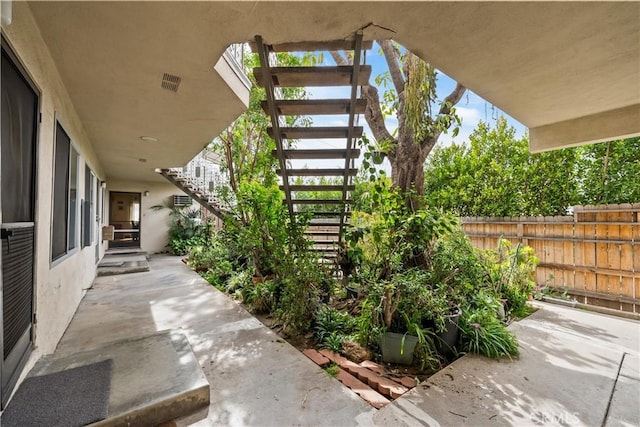 view of patio / terrace featuring fence