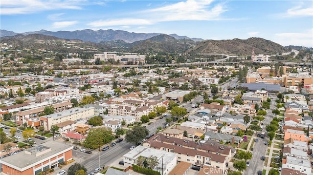 birds eye view of property with a mountain view