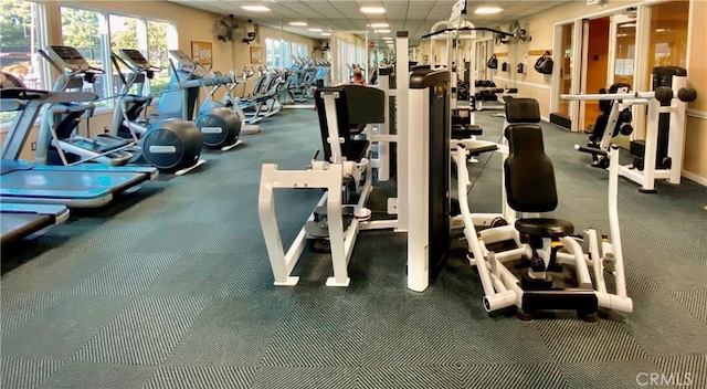 workout area featuring a paneled ceiling