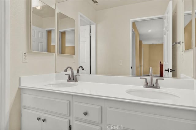 bathroom with double vanity and a sink