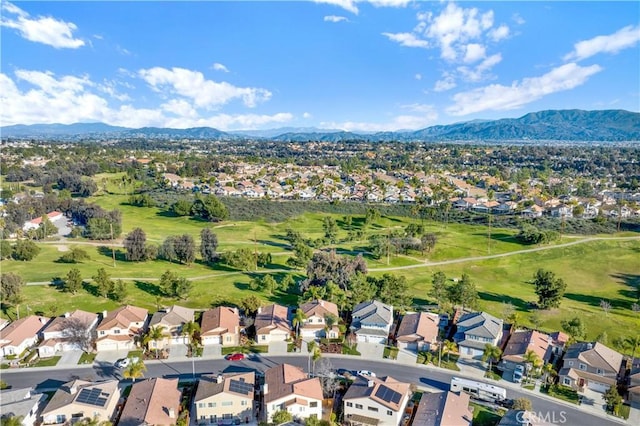 aerial view featuring a mountain view, golf course view, and a residential view