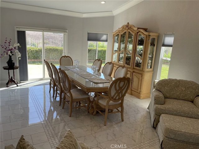 dining area featuring ornamental molding