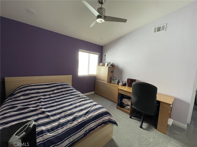 bedroom with baseboards, visible vents, lofted ceiling, ceiling fan, and carpet flooring