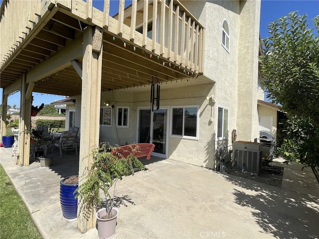 view of patio / terrace featuring a balcony, grilling area, and cooling unit