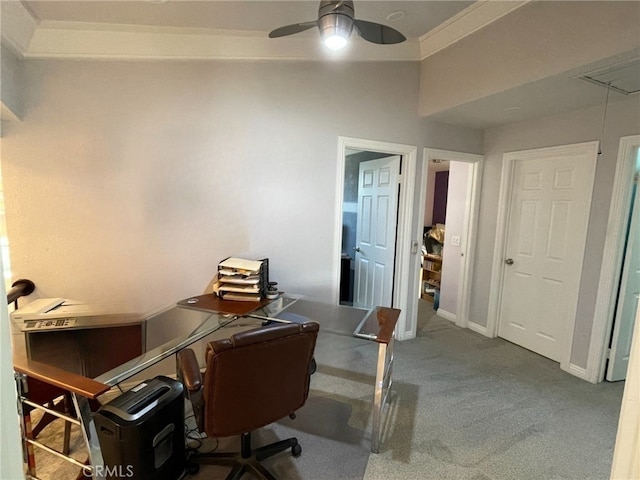 carpeted home office with ceiling fan, attic access, and baseboards