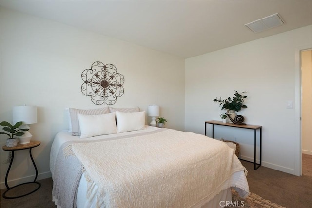 bedroom with carpet, visible vents, and baseboards