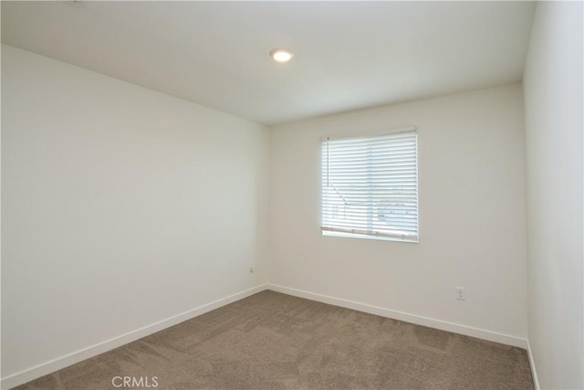 unfurnished room featuring recessed lighting, carpet flooring, and baseboards