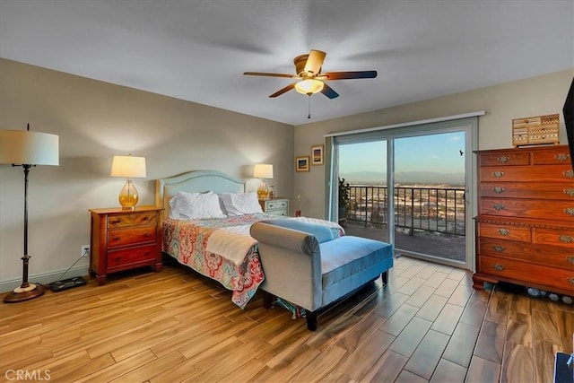 bedroom with access to outside, ceiling fan, and wood finished floors