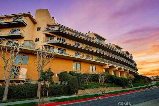 view of property at dusk