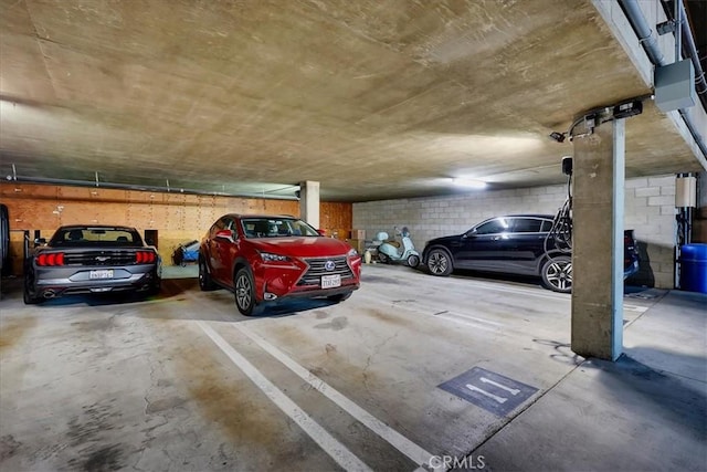 parking deck featuring concrete block wall