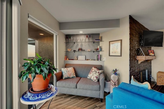 living room featuring wood finish floors and a fireplace