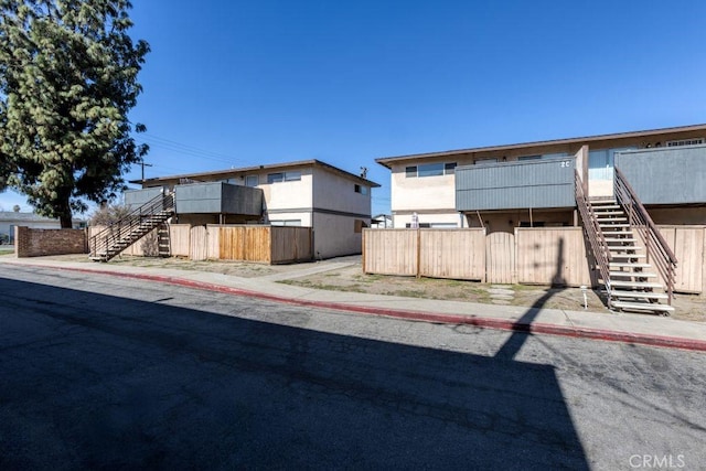 exterior space with stairway and fence