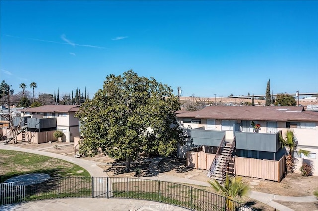 view of front of house with fence and a residential view