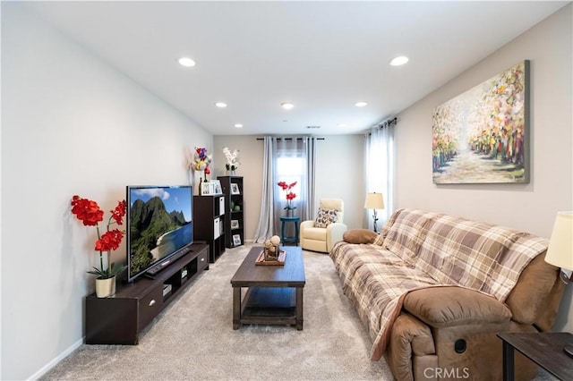 living room featuring carpet, baseboards, and recessed lighting