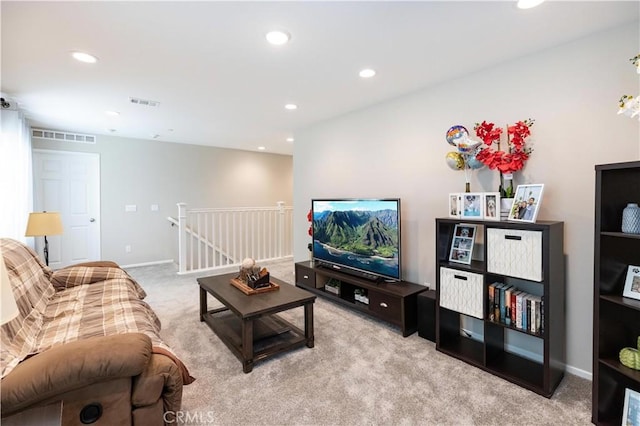 carpeted living room with baseboards, visible vents, and recessed lighting