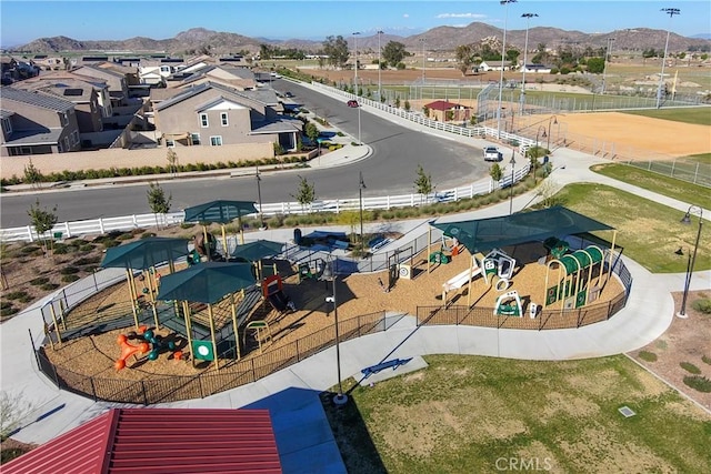 birds eye view of property with a residential view and a mountain view