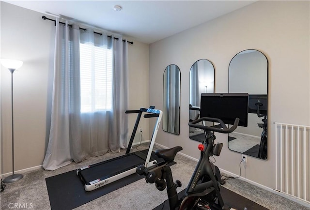 workout area with carpet and baseboards